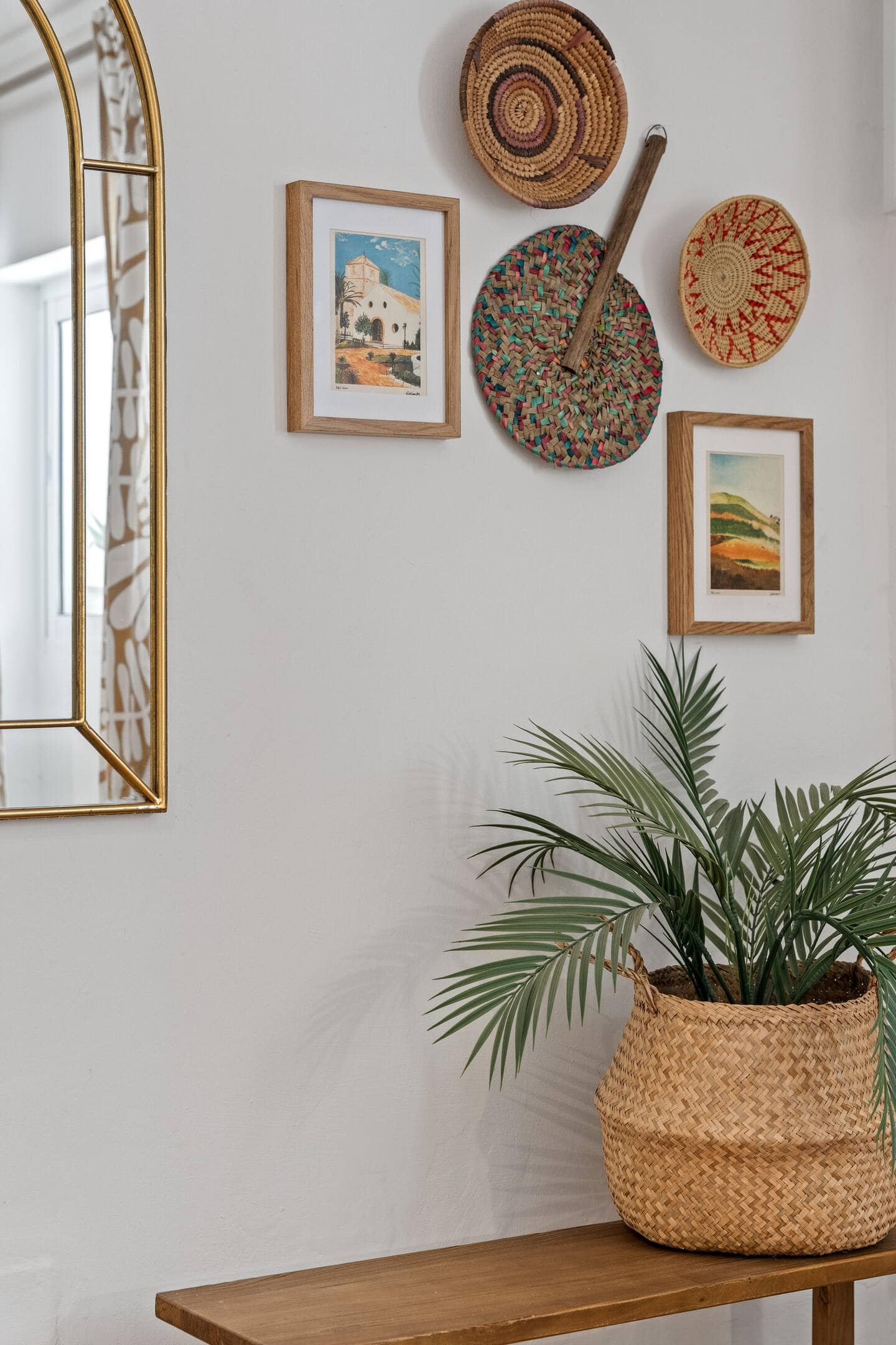 Wall decor with mirror and plant