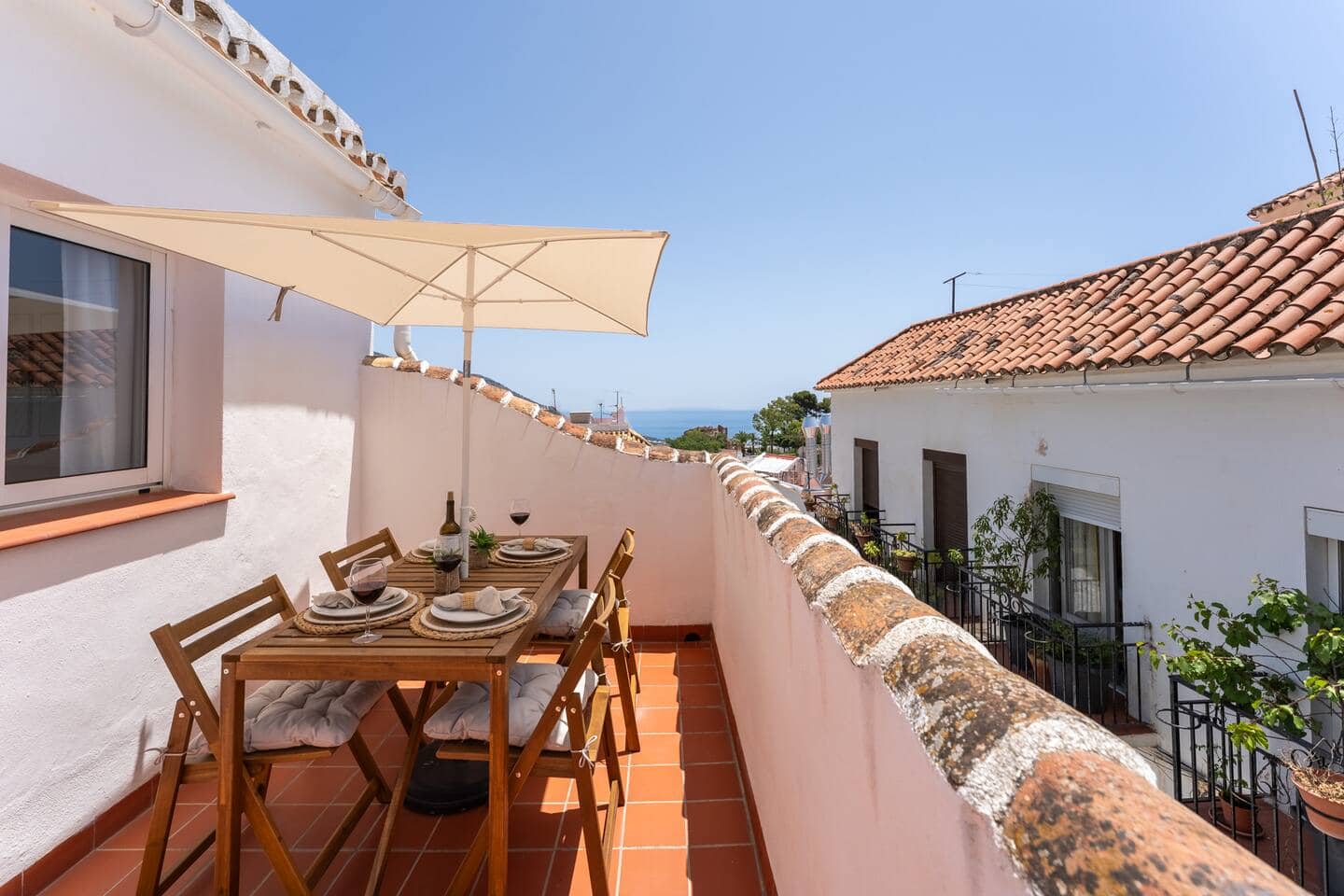 Roof terrace with parasol and sea view
